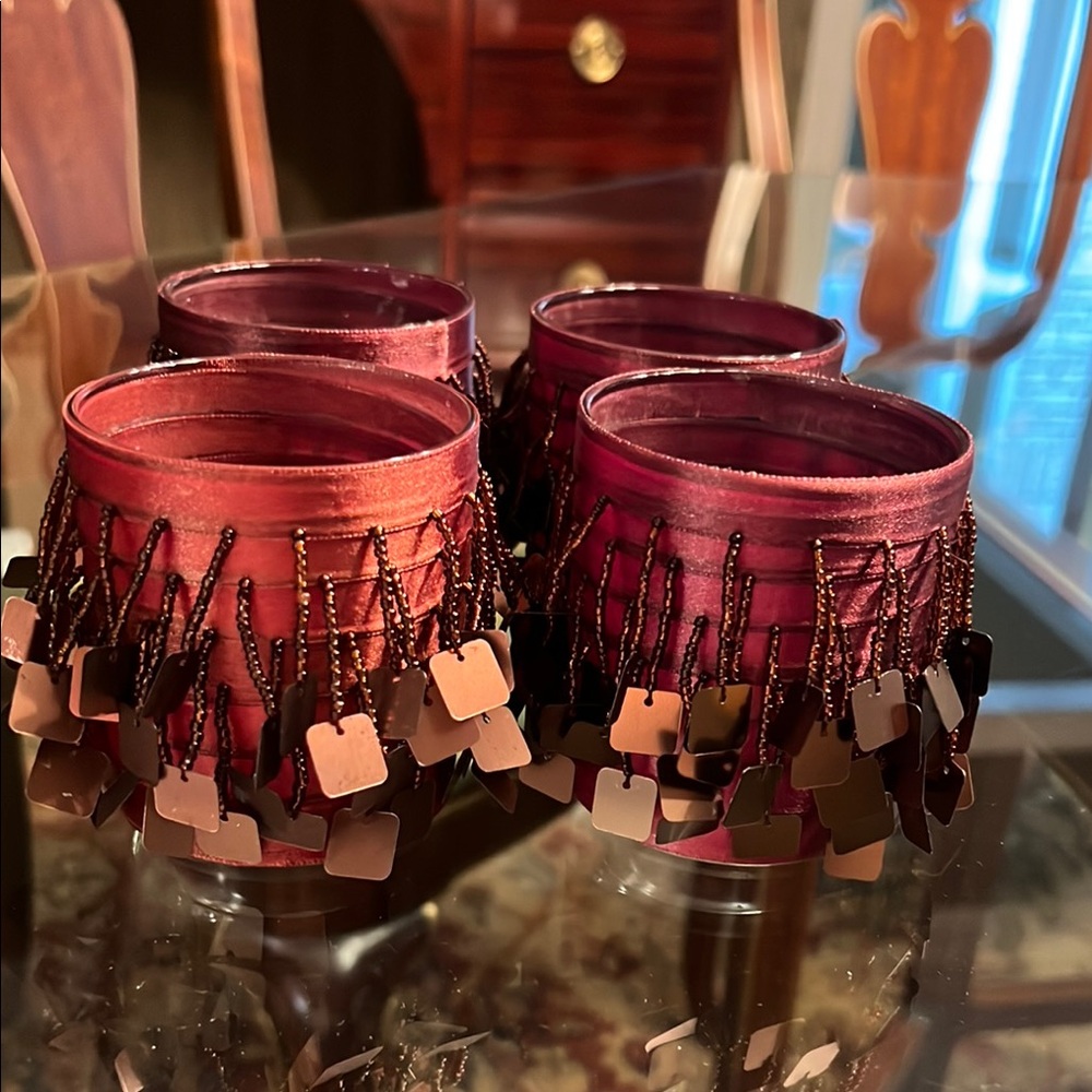 Boutique votive candle holders wrapped in brown silk with little beads hanging